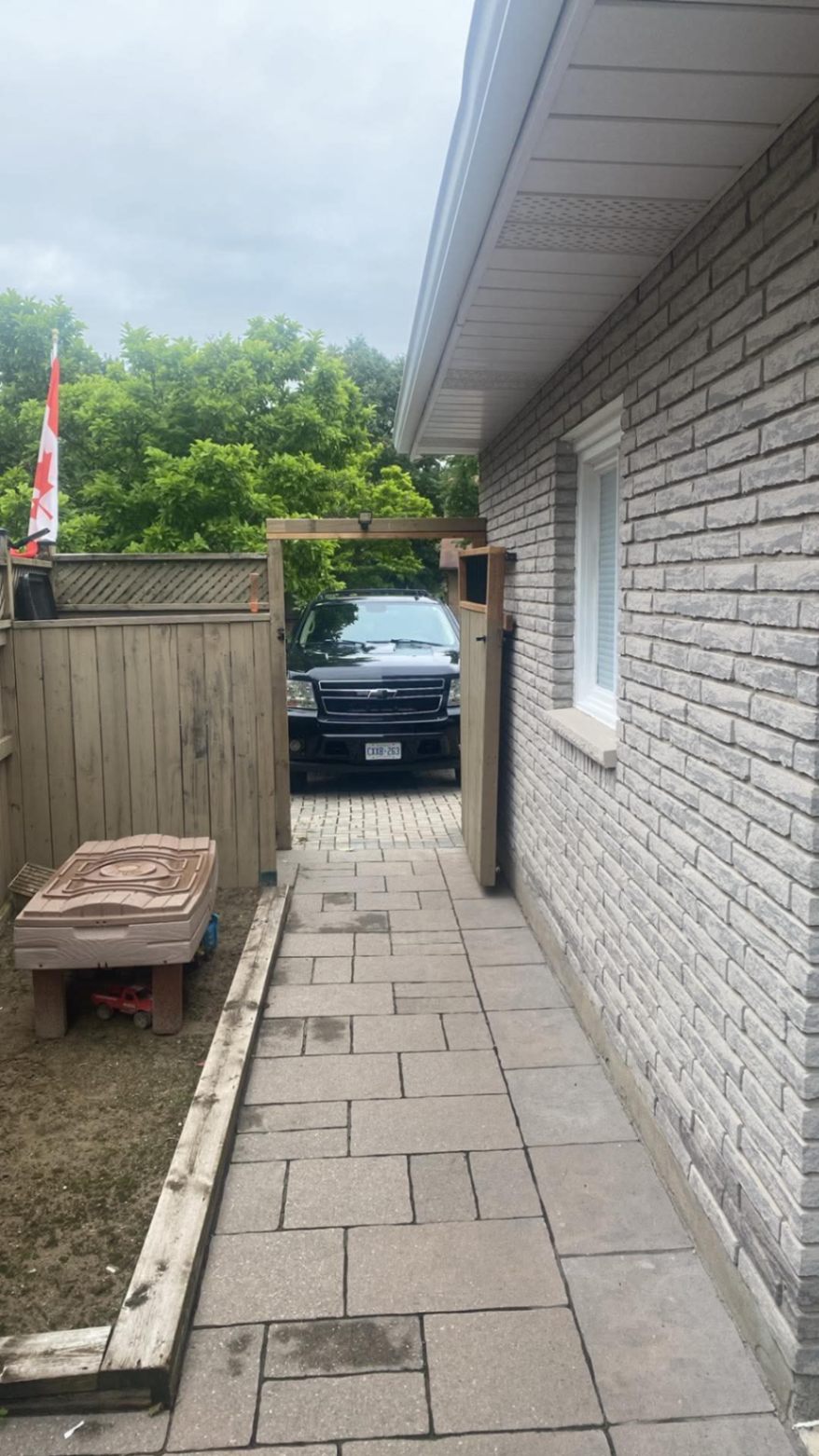 Customer-submitted photo of a failing fence estimated at 3–7 years old (example 10)