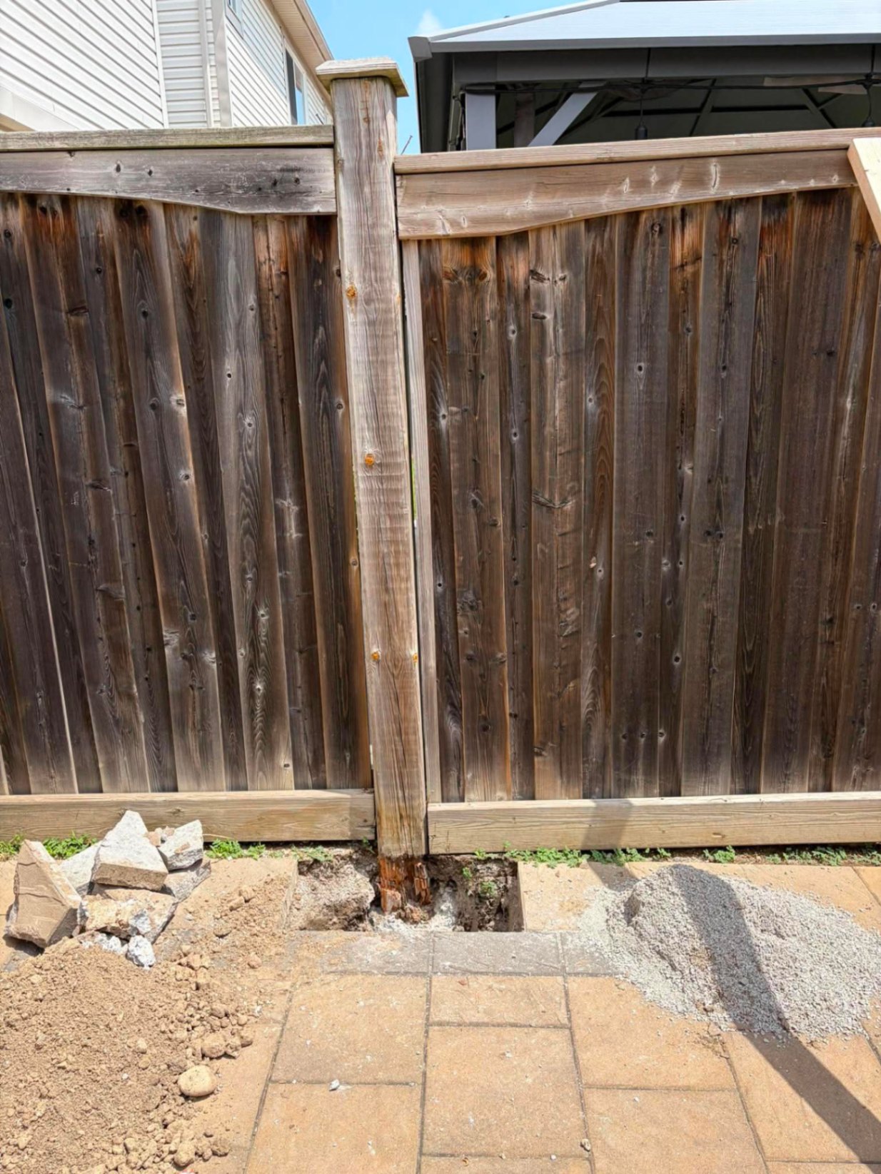 Customer-submitted photo of a failing fence estimated at 8–15 years old (example 2)