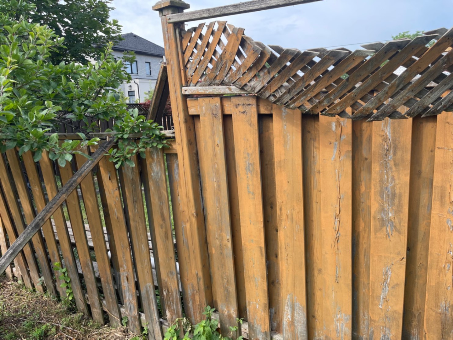 Customer-submitted photo of a failing fence estimated at 8–15 years old (example 8)