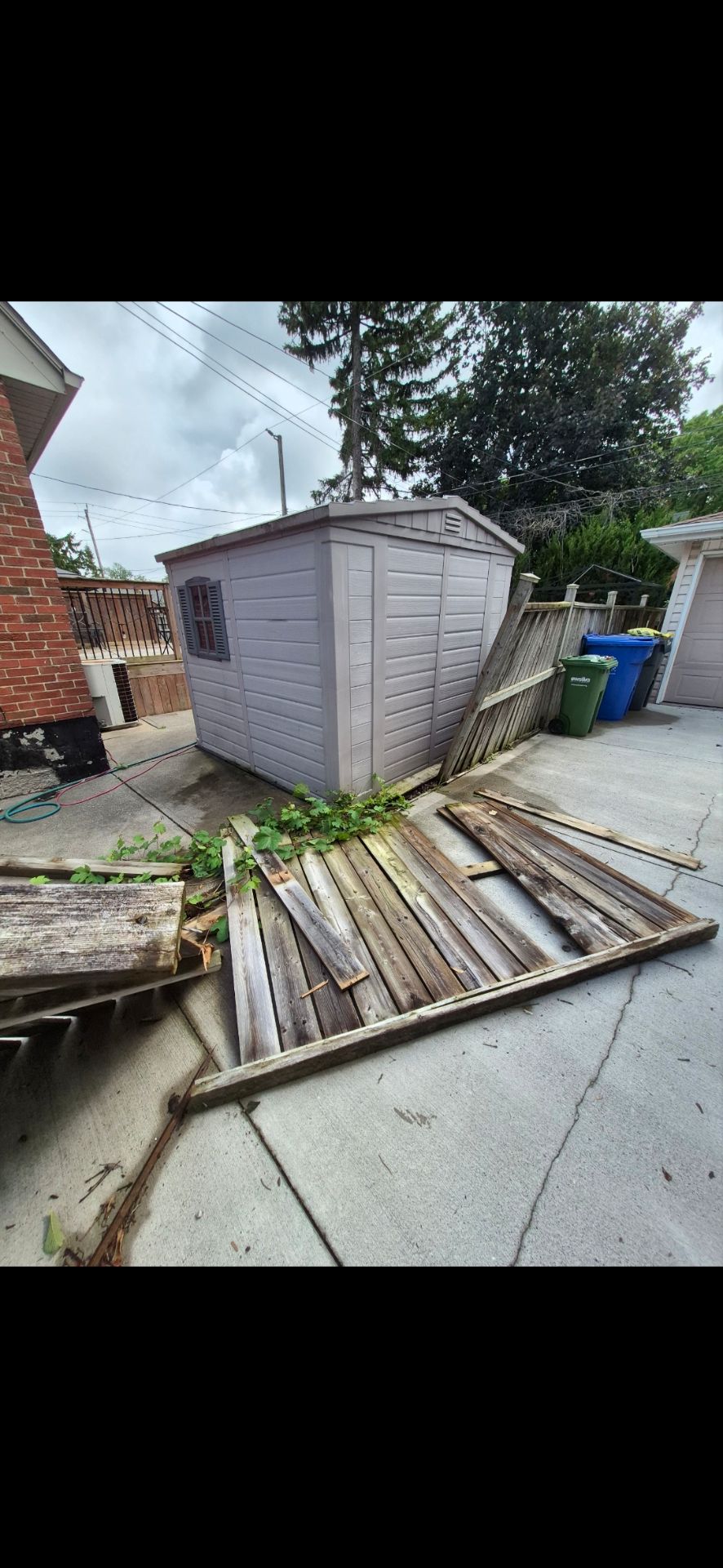 Customer-submitted photo of a failing fence estimated at 15+ years old (example 4)