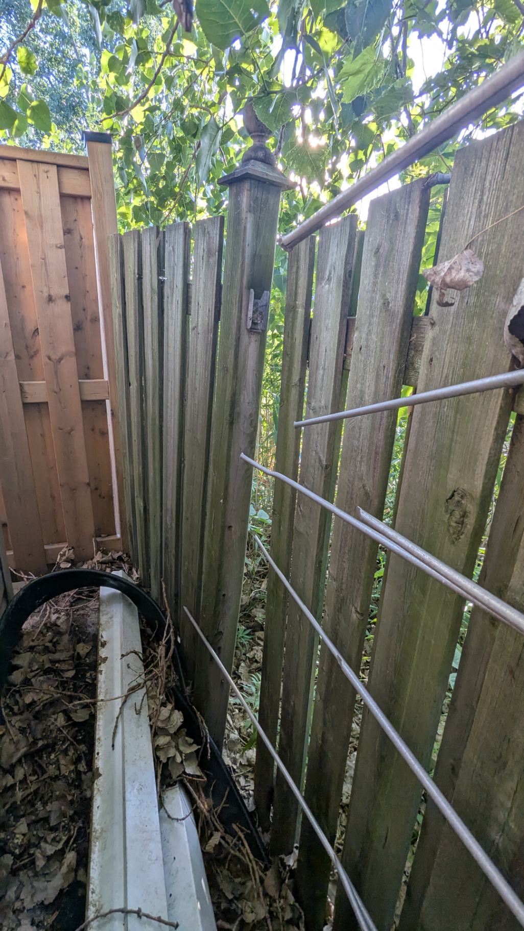Customer-submitted photo of a failing fence estimated at 15+ years old (example 6)