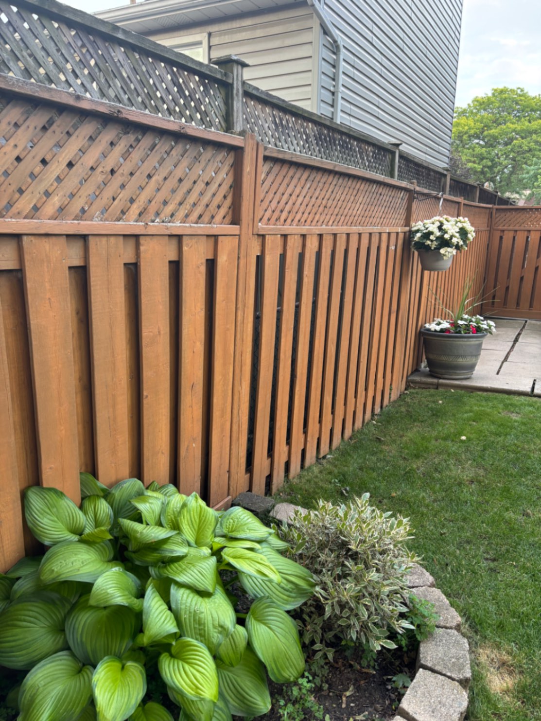Customer-submitted photo of a failing fence estimated at 3–7 years old (example 1)