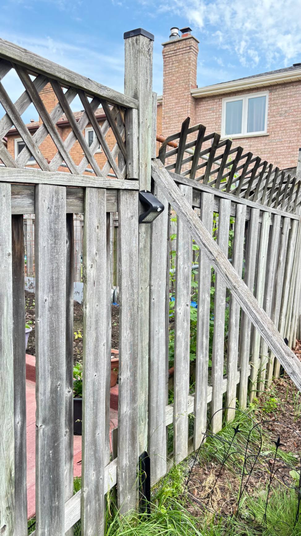 Customer-submitted photo of a failing fence estimated at 8–15 years old (example 1)