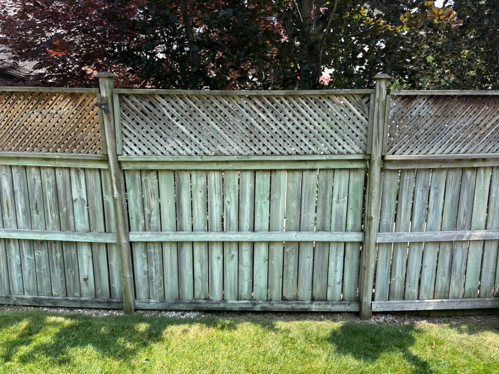 Customer-submitted photo of a failing fence estimated at 8–15 years old (example 9)